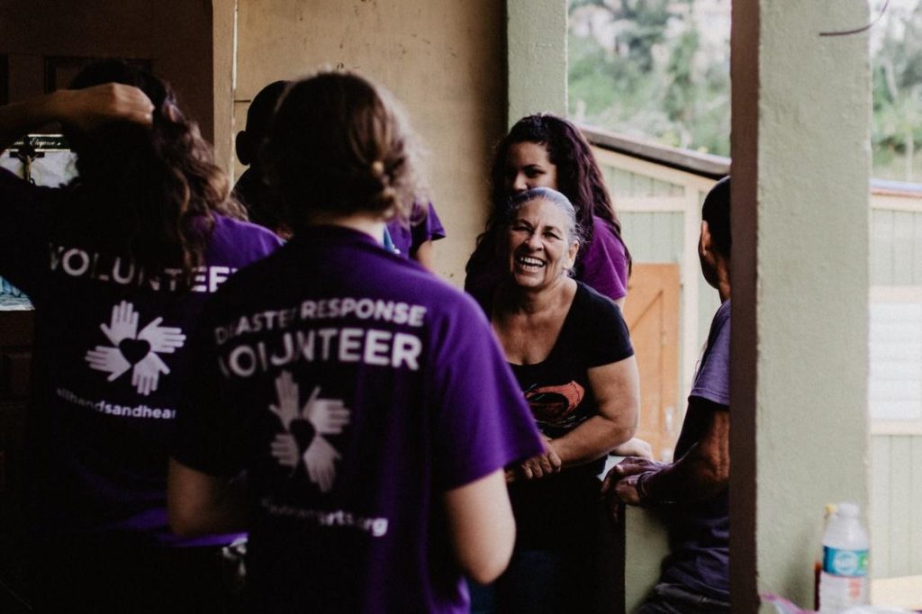 puertorico_pr_hurricane_volunteer_beneficiary_group_smiling_laughing