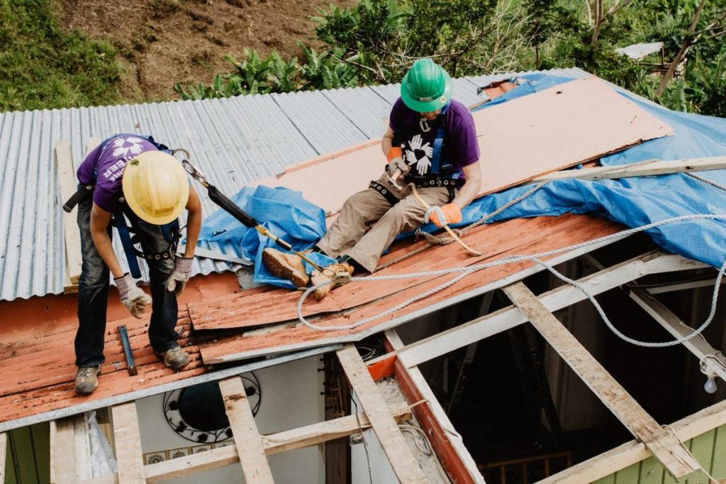 puertorico_pr_usa_hurricane_recovery_roof_homebuild_volunteer_couple_working