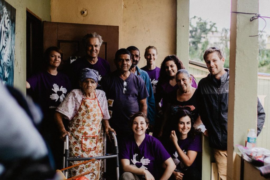 puertorico_pr_usa_volunteer_beneficiary_group_hugging_smiling