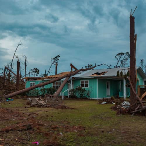 A turquoise-colored home in Florida destroyed by Hurricane Michael