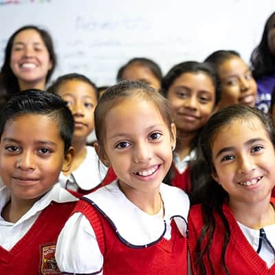 Happy school children of Mexico smiling in a new All Hands and Hearts - Smart Response school classroom