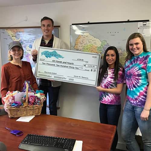 Fundraise-Cheque-Smiling.jpg All Hands and Hearts - Smart Response members receiving a fundraised donation in the form of a large cheque