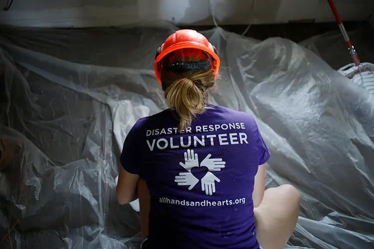 volunteer kneeling