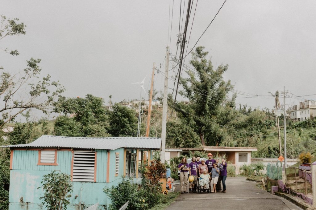 barranquitas_puertorico_pr_usa_volunteer_beneficiary_group_hugging_smiling