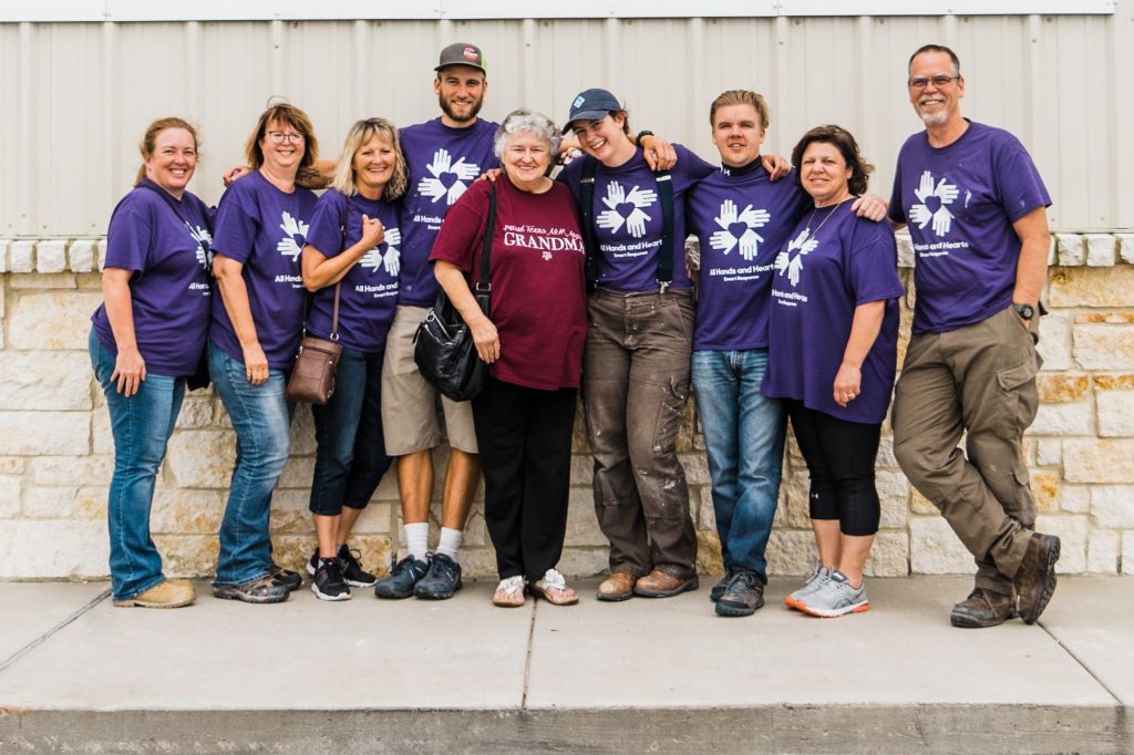 coastal_bend_texas_usa_homebuild_volunteer_beneficiary_group_smiling_hugging