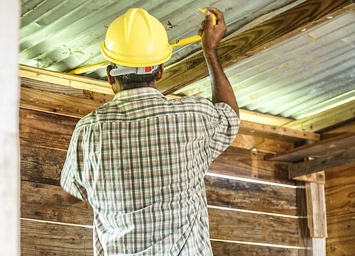 dominica_hurricane_homebuild_beneficiary_one_working