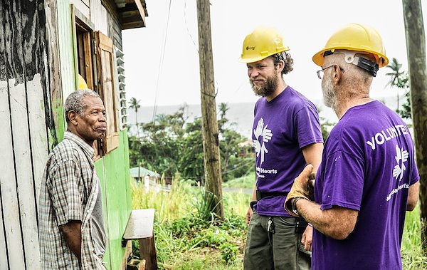 dominica_hurricane_volunteer_beneficiary_group_smiling