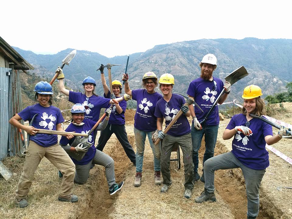 group of people flexing on a worksite
