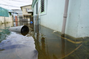 Flooded building with inches of standing water outside