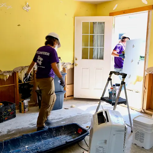 two people working inside home