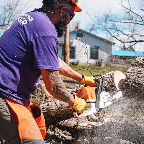 cutting up tree with chainsaw